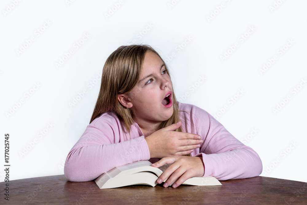 yawning girl with book on white background yawning girl with book on white background