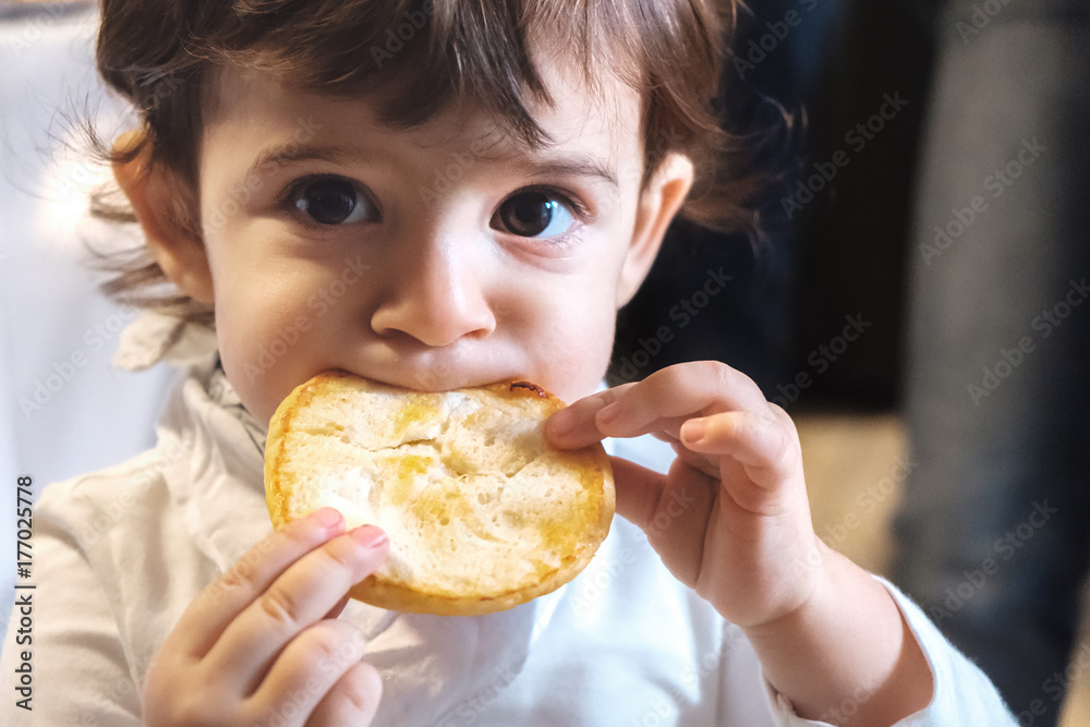 baby child eat carbohydrates - newborn eating face closeup portrait - unhealthy diet for kids baby child eat carbohydrates - newborn eating face closeup portrait - unhealthy diet for kids