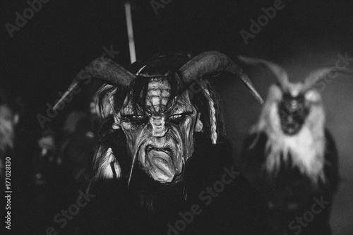 wooden hand carved scary masks from a krampus photo