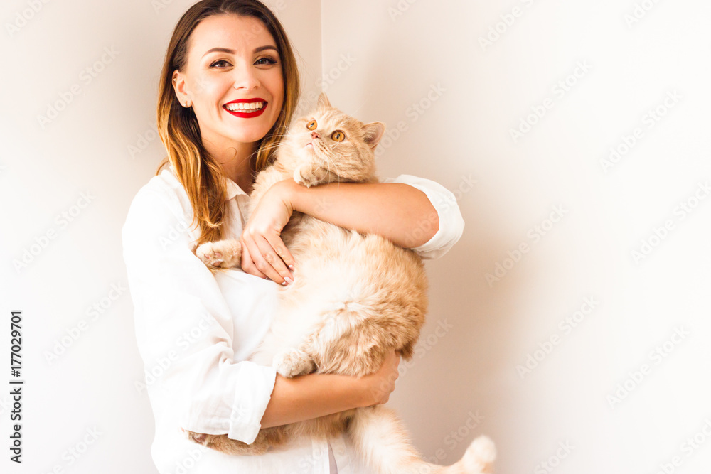Beautiful girl with a red cat Beautiful girl with a red cat