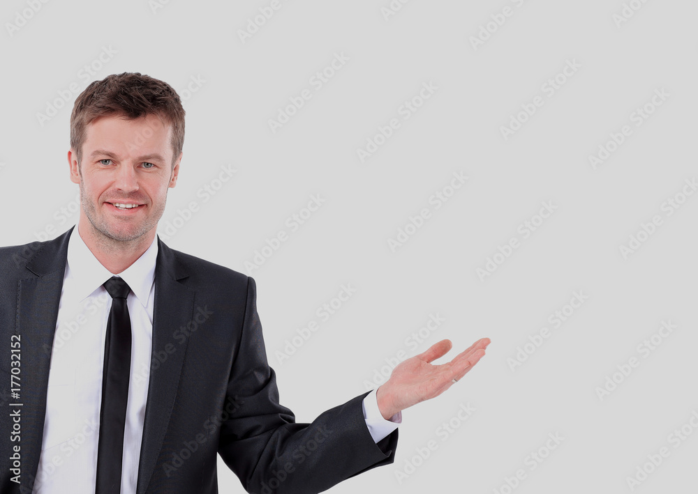 Happy smiling business man showing blank area for sign or copysp Happy smiling business man showing blank area for sign or copysp