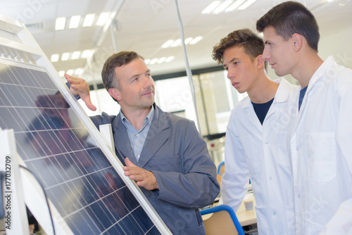 Students being showed a solar panel