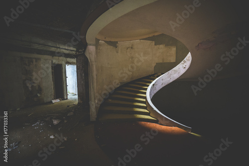 a decayed stairway in an abandoned hotel
