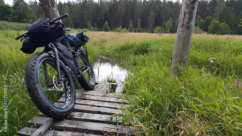 fatbike in the swamp on the old bridge photo