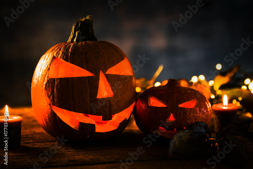 Halloween pumpkin head jack lantern with burning candles