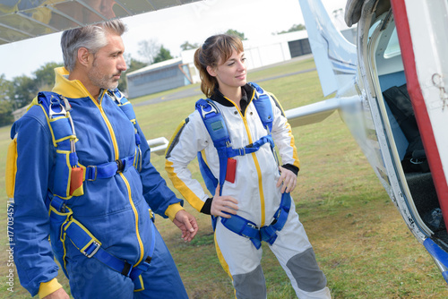 Parachuters about to board plane photo