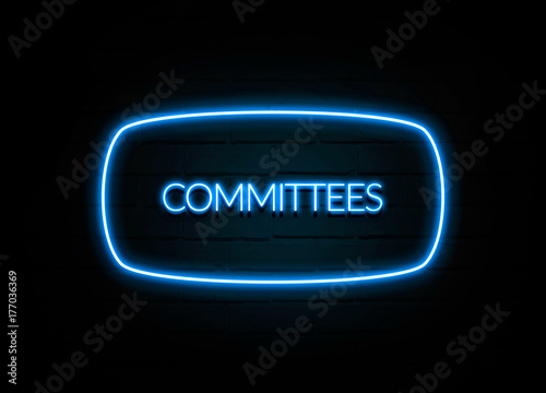 Committees - colorful Neon Sign on brickwall