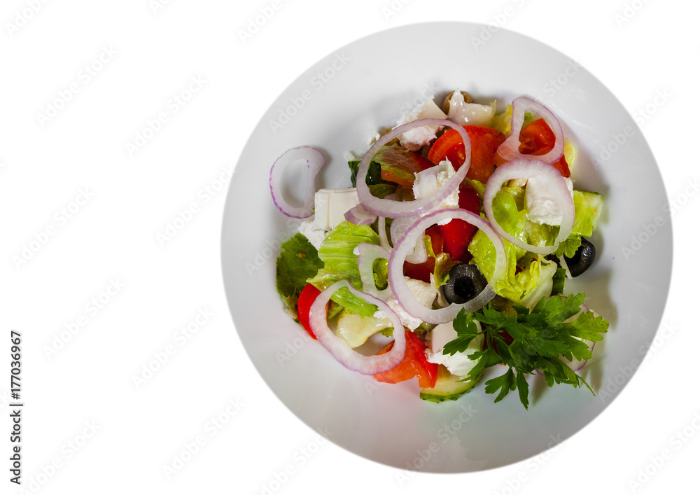 vegetable salad with cheese, cabbage, pepper, tomato and cucumber. with copy space. top view. isolated on white