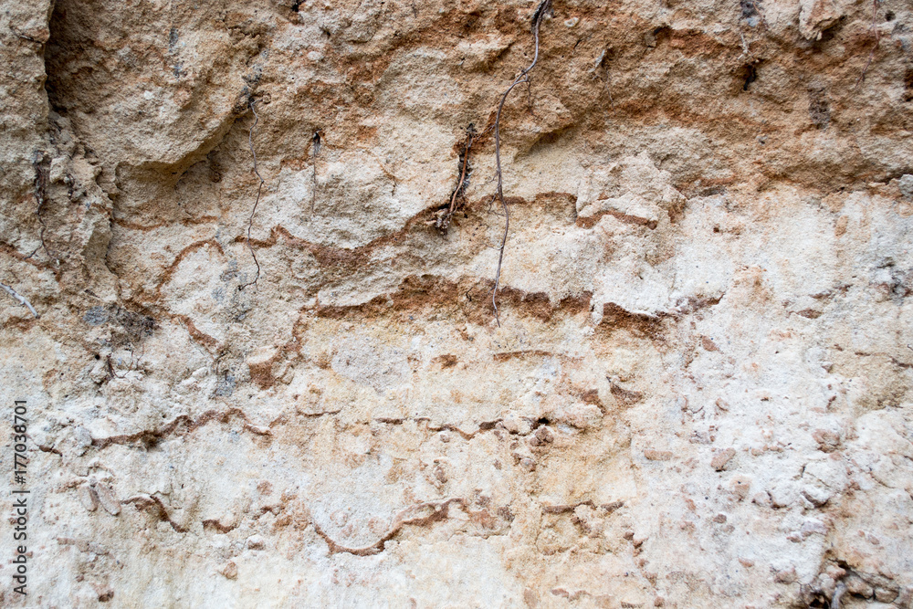 Naklejka premium Bright yellow orange background with layers of sand and clay