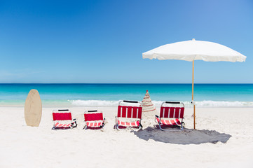 Christmas morning at the beach in Western Australia, with beach chairs and a sand christmas tree