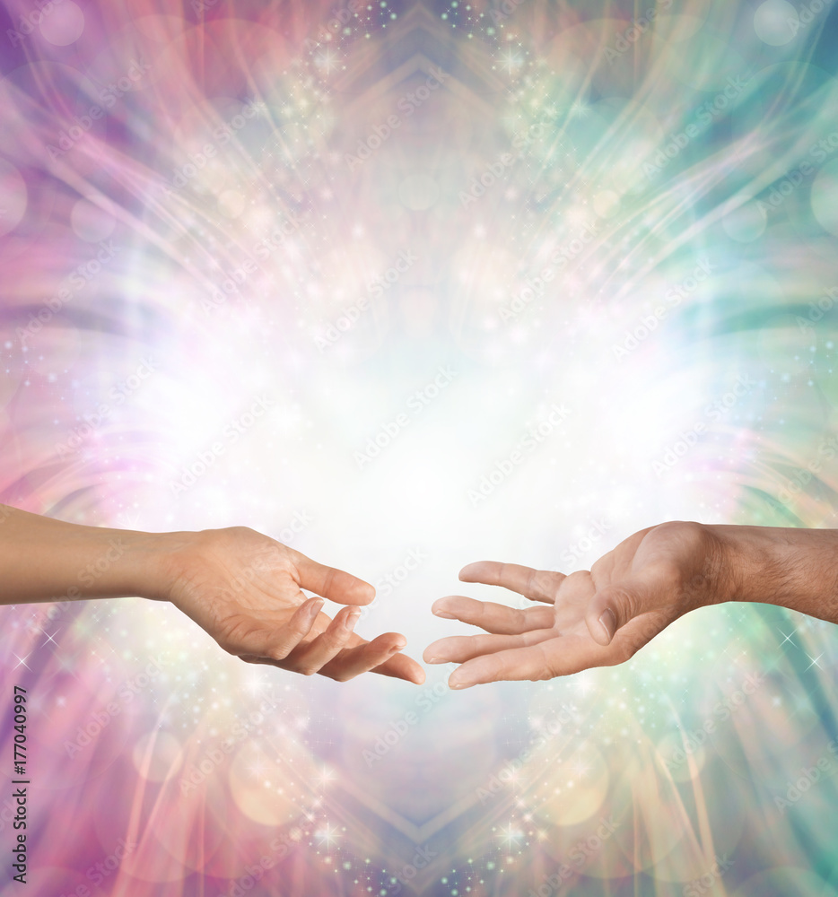 Male and Female energy merging - a female hand and a male hand with open palms facing each other against a beautiful intricate masculine and feminine colored energy background with copy space above
 - obrazy, fototapety, plakaty 