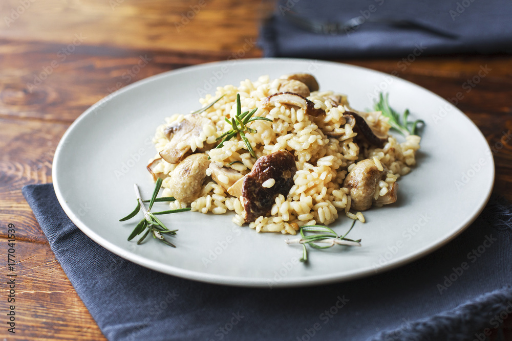 delicious rice with mushrooms and rosemary, risotto. delicious rice with mushrooms and rosemary, risotto.