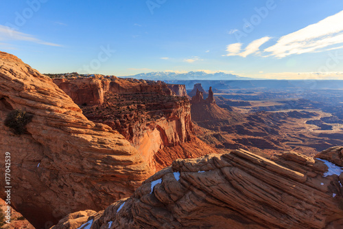 The late afternoon sun beats down on the red landscape of Canyonlands National Park  Utah