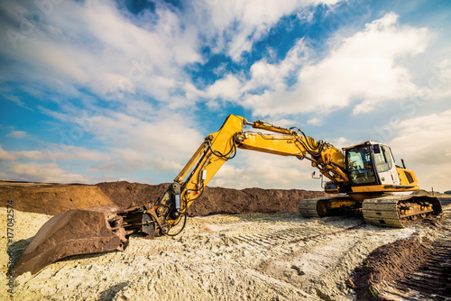 Big excavator in construction site