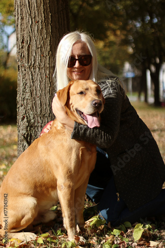 Woman enjoying park with dog