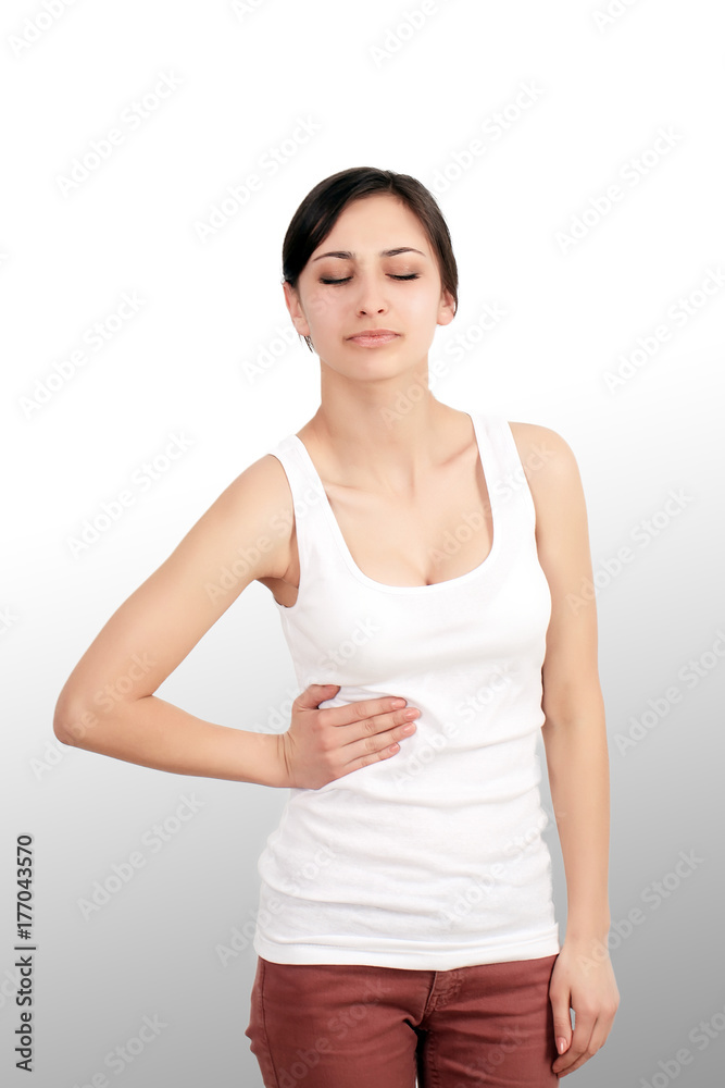 Pain. Woman hand holding abdominal with stomach ache lying on bed, health care and medical concept Pain. Woman hand holding abdominal with stomach ache lying on bed, health care and medical concept