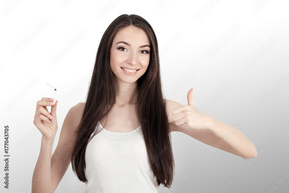Beautiful Woman Holding Broken Cigarette. Quitting Cigarettes Beautiful Woman Holding Broken Cigarette. Quitting Cigarettes