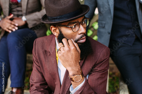 Portrait of a dapper studious gentleman wearing reading glasses photo