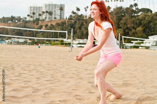 Woman Playing Beach Volleyball photo