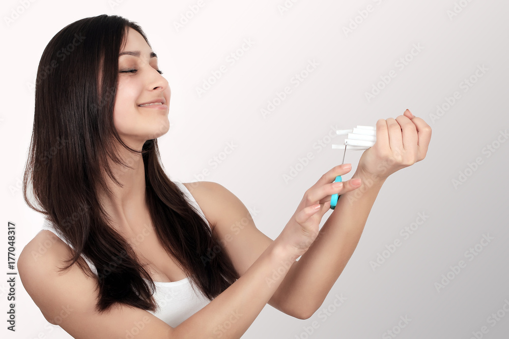 Stop Smoking Cigarettes Concept. Portrait Of Beautiful Smiling Woman Holding Broken Cigarette In Hands. Happy Female Quitting Smoking Cigarettes. Quit Bad Habit Concept. High Resolution Stop Smoking Cigarettes Concept. Portrait Of Beautiful Smiling Woman Holding Broken Cigarette In Hands. Happy Female Quitting Smoking Cigarettes. Quit Bad Habit Concept. High Resolution
