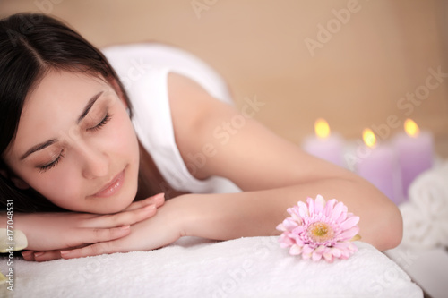 Body Care. Spa Woman. Beauty Treatment Concept. Beautiful Healthy Caucasian Girl Relaxing On Massage Table Before Hand Massage On Relaxed Back In Health And Spa Salon. Skin Care, Wellness, Lifestyle
