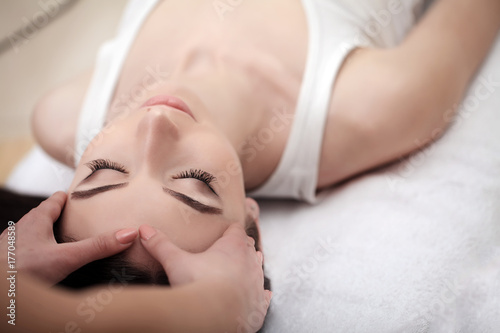 Skin And Body Care. Close-up Of A Young Woman Getting Spa Treatment At Beauty Salon. Spa Face Massage. Facial Beauty Treatment. Spa Salon.