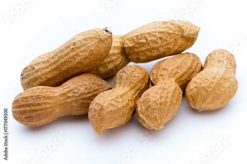 Dried peanuts on the white background.