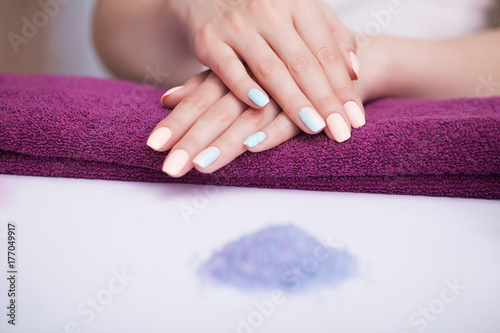 Spa Nail Procedures. Beautiful manicure on the hands. Beautiful hands after a spa treatment. The concept of spa and beauty.