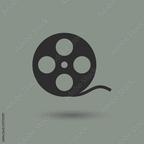 Cinema film reel in modern style with shadow and gray background. Symbol of a movie, theater and old documentary.