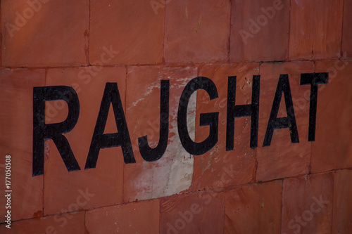 DELHI, INDIA - SEPTEMBER 25 2017: Informative sign written over a clay bricks in Rajghat New Delhi, memorial in Delhi, India photo