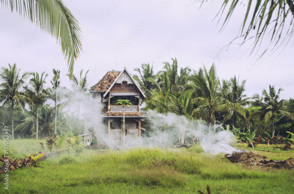 Smoke drifting across Balinese home Smoke drifting across Balinese home