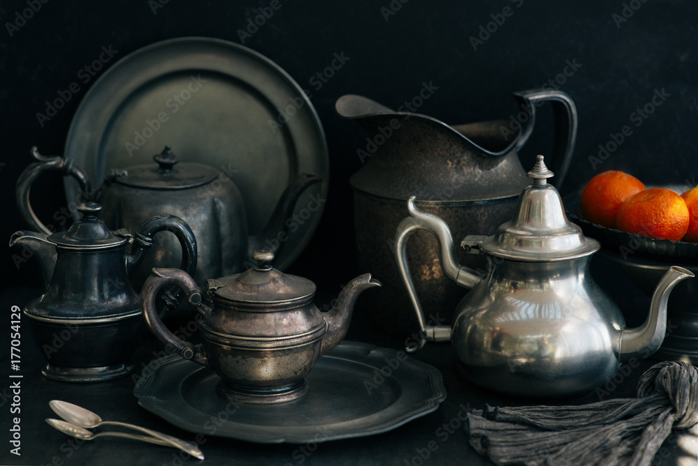 A set of pewter plates, platters, and pots. A set of pewter plates, platters, and pots.