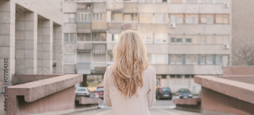 Attractive female model from back on the street