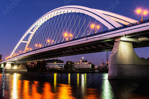 Photography Illuminated Apollo bridge at night in Bratislava, Slovakia