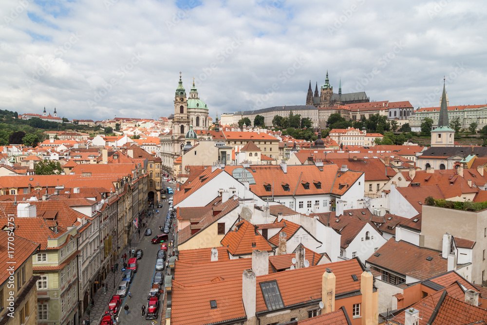 View of old buildings from above, St. Nicholas Church and Prague (Hradcany) Castle at the Mala Strana District (Lesser Town) in Prague, Czech Republic.