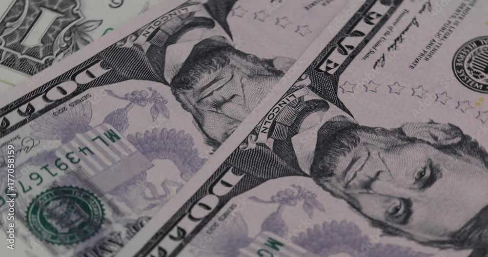 Close up heap of dollars, selective focus. Dollars, the us money background, 4K movie. Close up heap of dollars, selective focus. Dollars, the us money background, 4K movie.