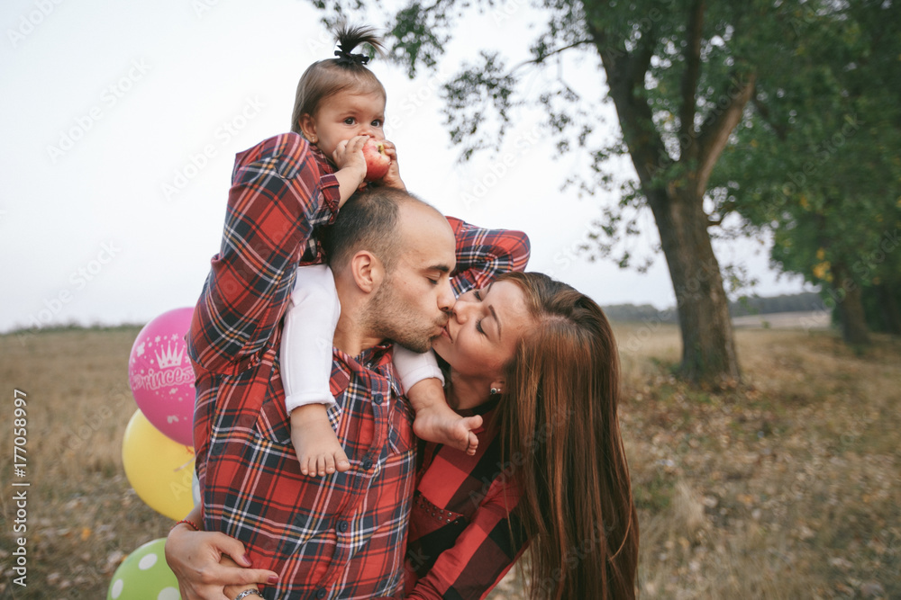 Fototapeta premium family in a field