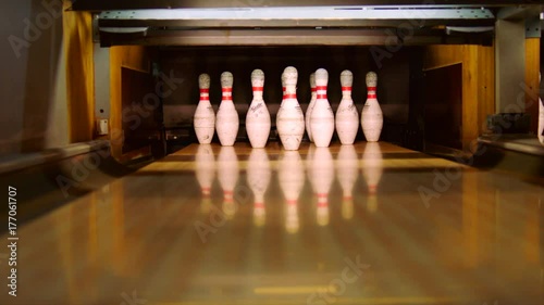 Bowling ball knocking all pins down