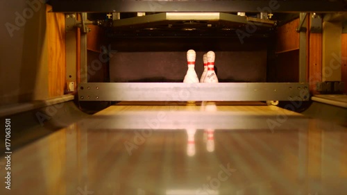 Three bowling pins on the lane