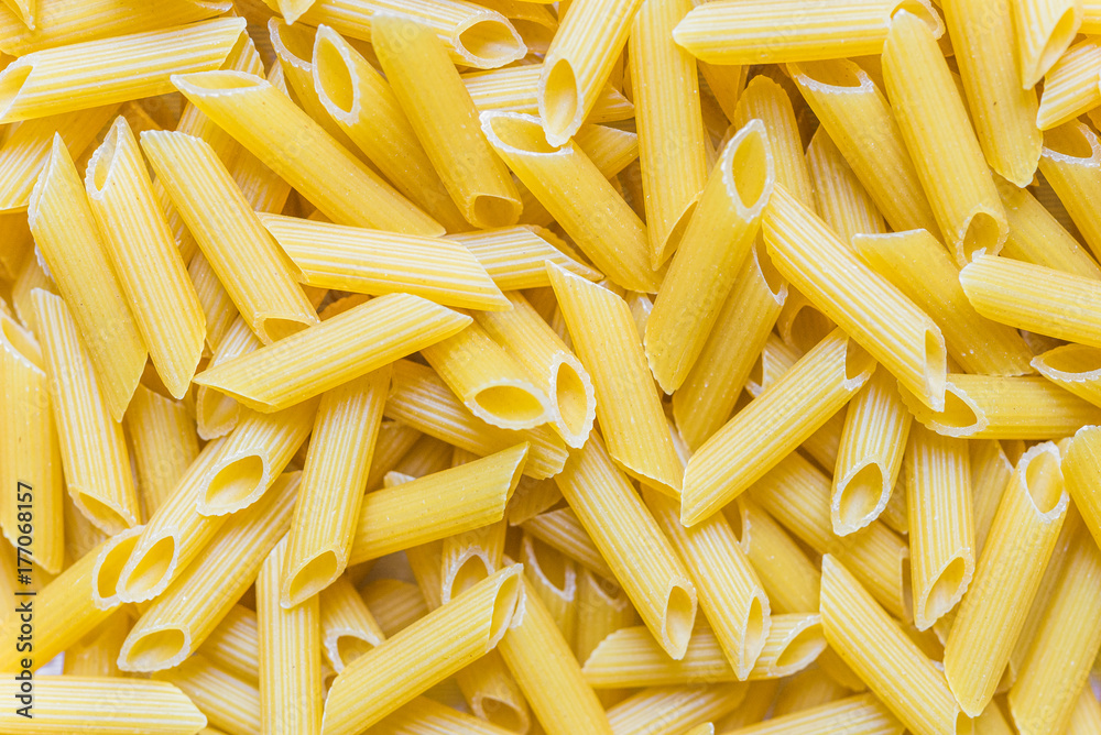 Colorful food background of penne rigate pasta Colorful food background of penne rigate pasta