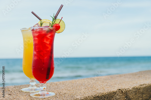 Iced cocktails drinking glass with beach and sea