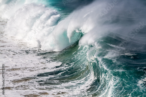 Giant Ocean wave at Waimea bay on the north shore of Oahu Hawaii