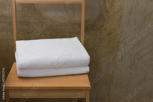 White towels on wood table.