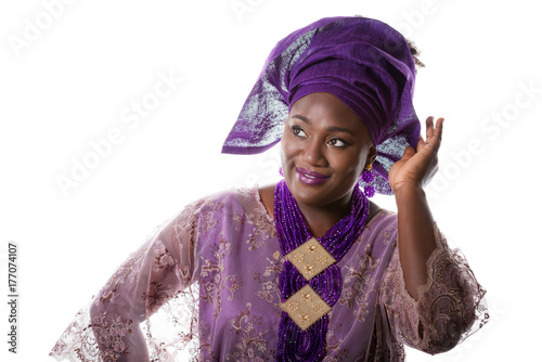 Closeup portrait of beautiful African model in traditional purple costume isolated