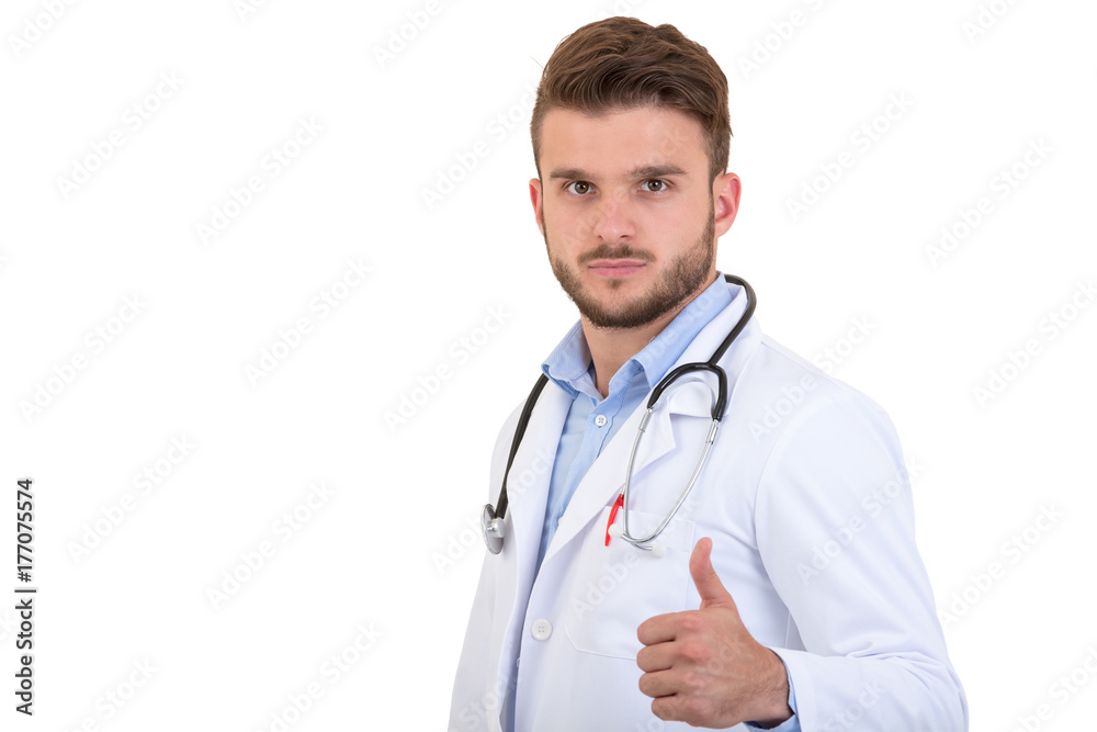 Successful young handsome and stylish bearded doctor in white uniform standing at white background with smile Successful young handsome and stylish bearded doctor in white uniform standing at white background with smile