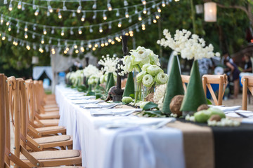 Beautiful decoration of luxury table set up by the beach. Concept for romantic wedding dinner party background.