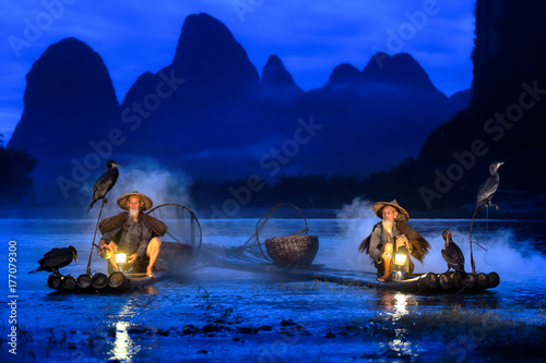 Fisherman of Guilin, Li River and Karst mountains during the blue hour of dawn,Guangxi China