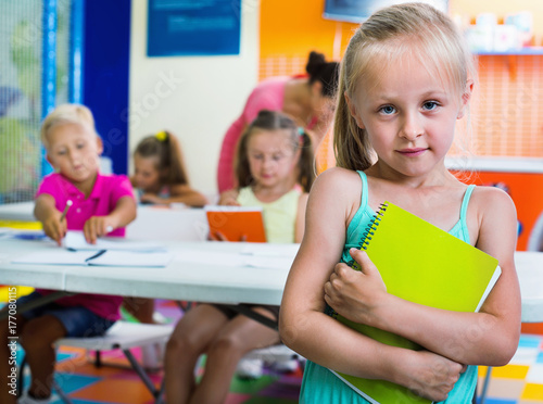 Portrait  pupil girl studying in school class