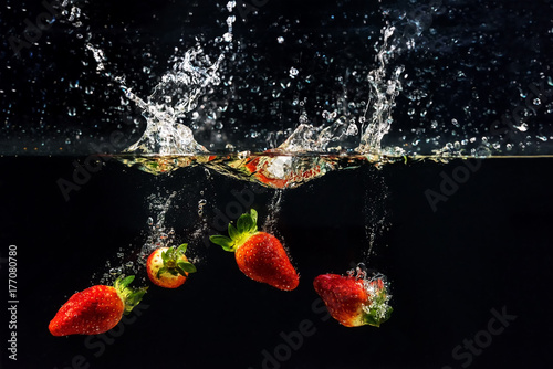 Photo of a vegetables and fruits dropped under water,soft and select focus
