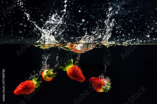Fototapeta Naklejka Na Ścianę i Meble -  Photo of a vegetables and fruits dropped under water,soft and select focus